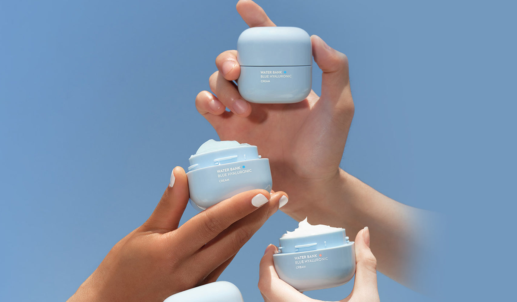 Hands holding LANEIGE skincare products, illustrating Discover the Magic of LANEIGE: Korean Skincare Now in Cambodia!