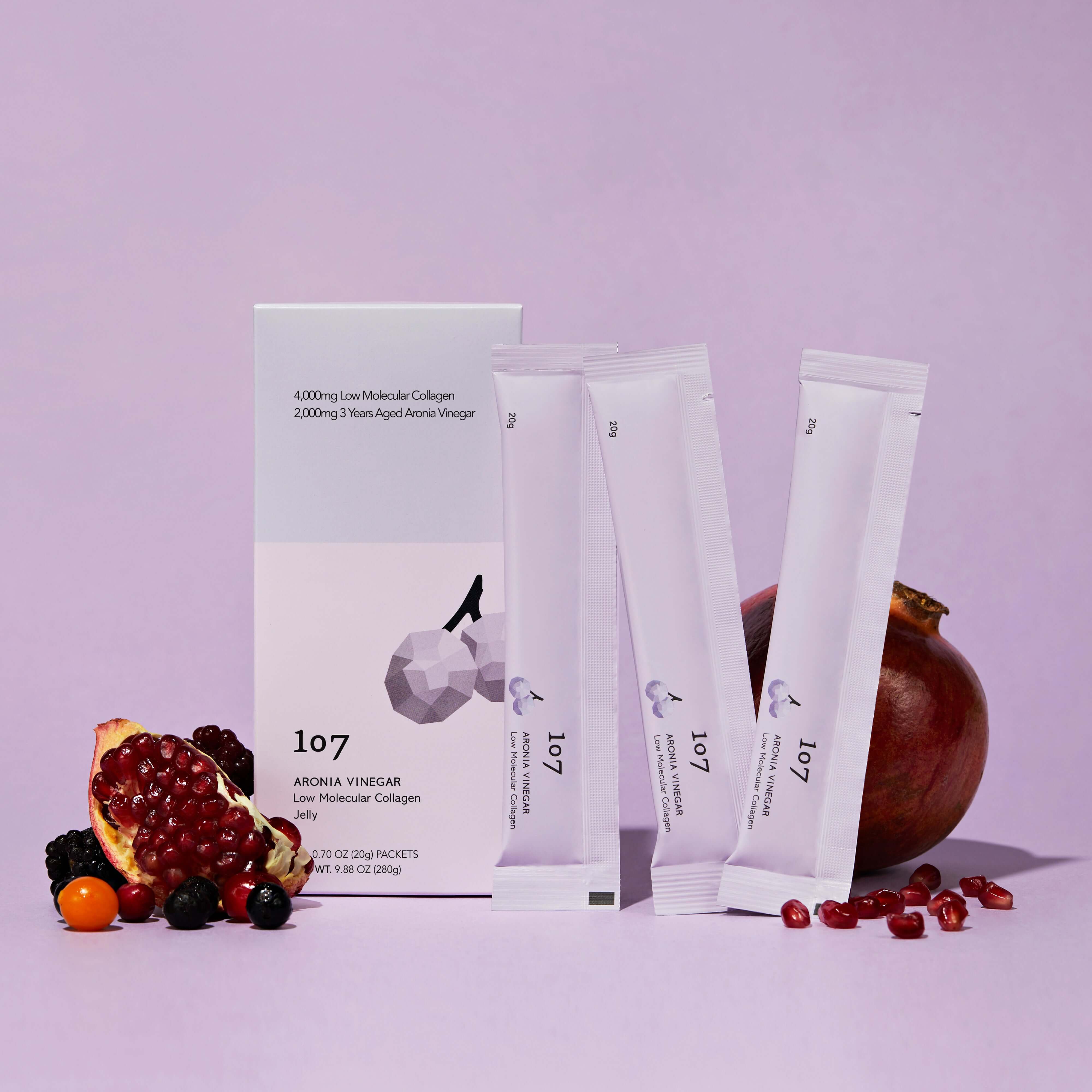 107 Aronia Vinegar Low Molecular Collagen 20g x 14 Packets with fruits displayed on a purple background