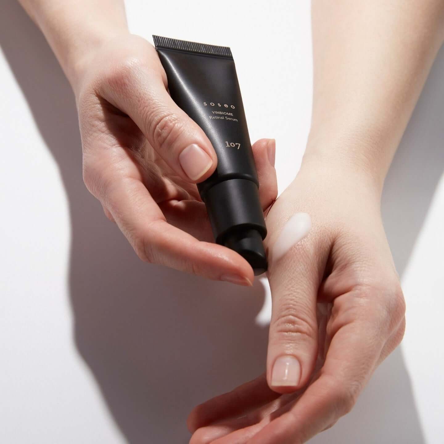 Applying 107 Soseo Vinbiome Retinal Serum 20ml on hand for skincare routine