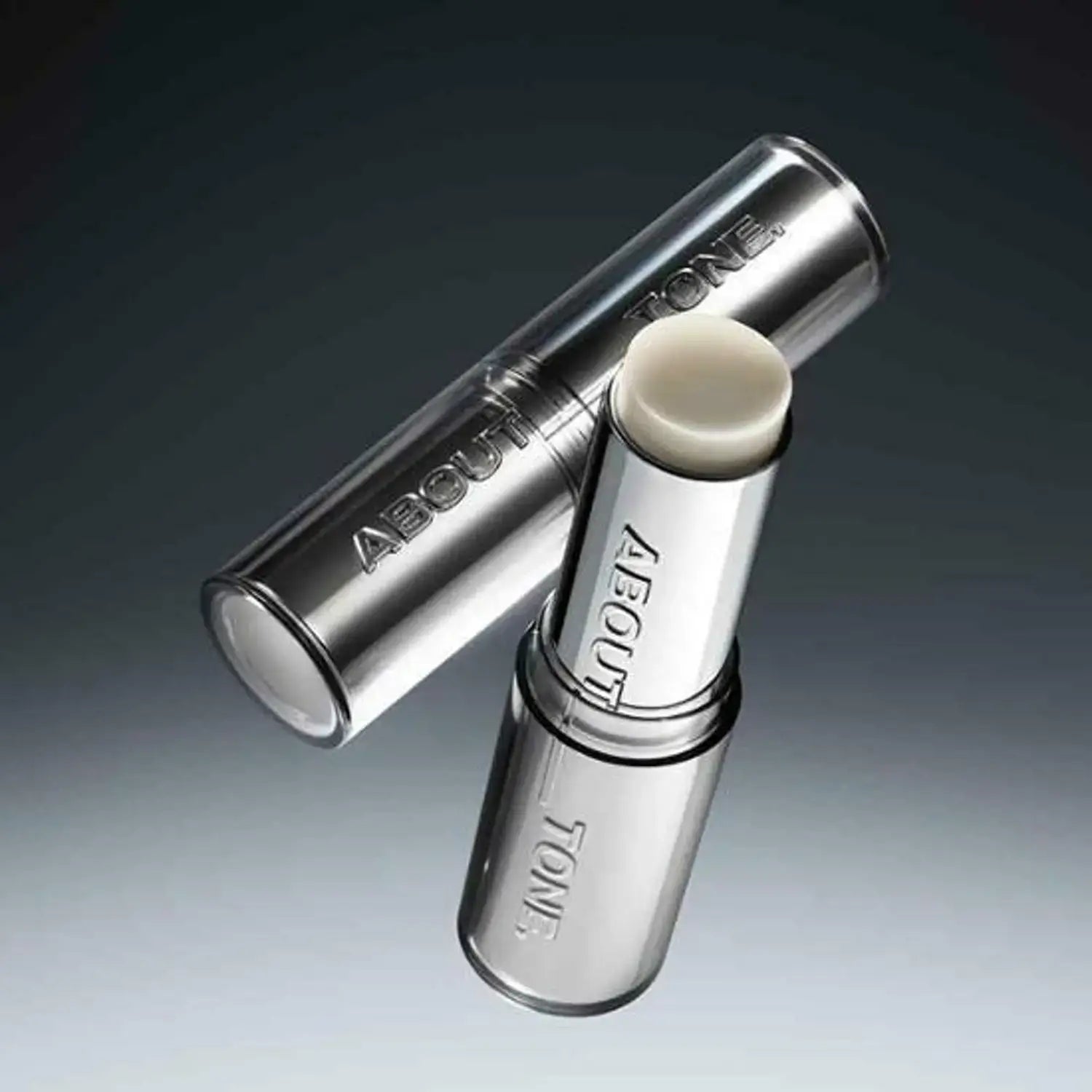 Close-up of the ABOUT TONE Blur Lasting Stick Primer in sleek packaging on a dark gradient background.