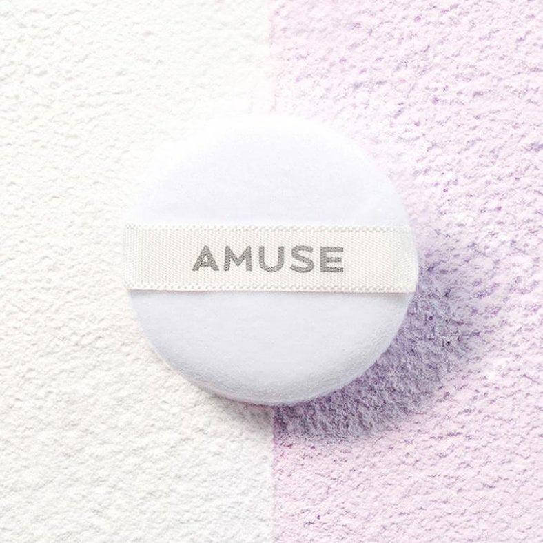 AMUSE Ceramic Sebum Powder on a textured background with dual colors