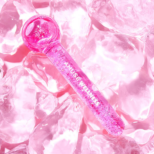 AMUSE Wellness Face Cooler on pink ice for skincare rejuvenation