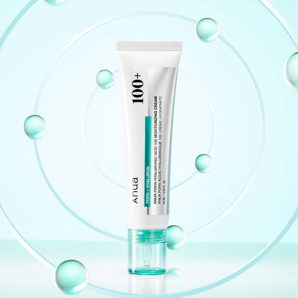ANUA PDRN Hyaluronic Acid 100 Moisture Cream in a sleek tube with a blue cap, surrounded by water droplets for hydration emphasis.