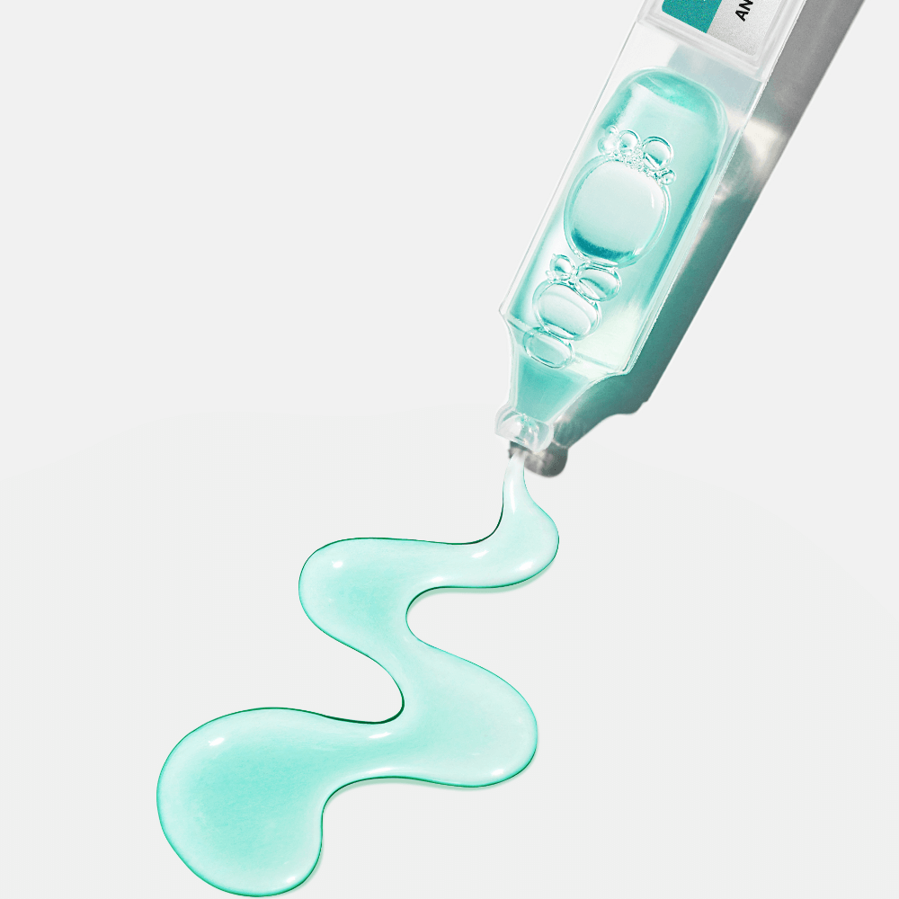 ANUA PDRN Hyaluronic Acid Capsule 100 Serum in a clear bottle with liquid flowing out, highlighting its hydrating properties.