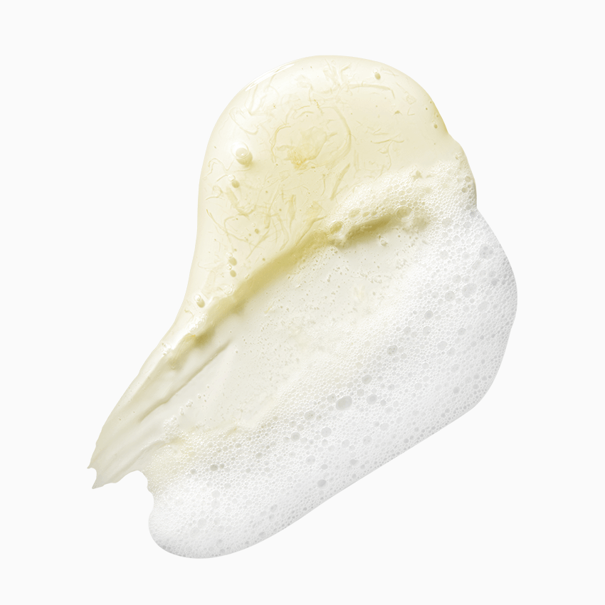 Texture of APRILSKIN Calendula Low PH Foam Cleanser showing creamy, foamy lather on white background.