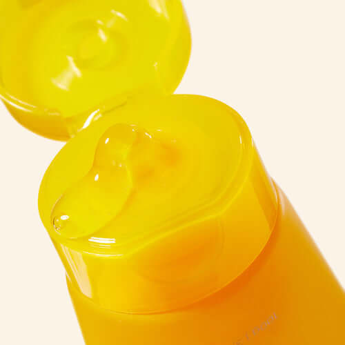 Close-up of APRILSKIN Calendula Peel Off Pack tube with open cap showing gel texture.