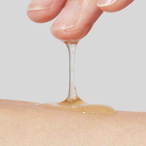 Application of APRILSKIN Calendula Peel Off Pack on skin, showing smooth texture and easy peel-off formula.