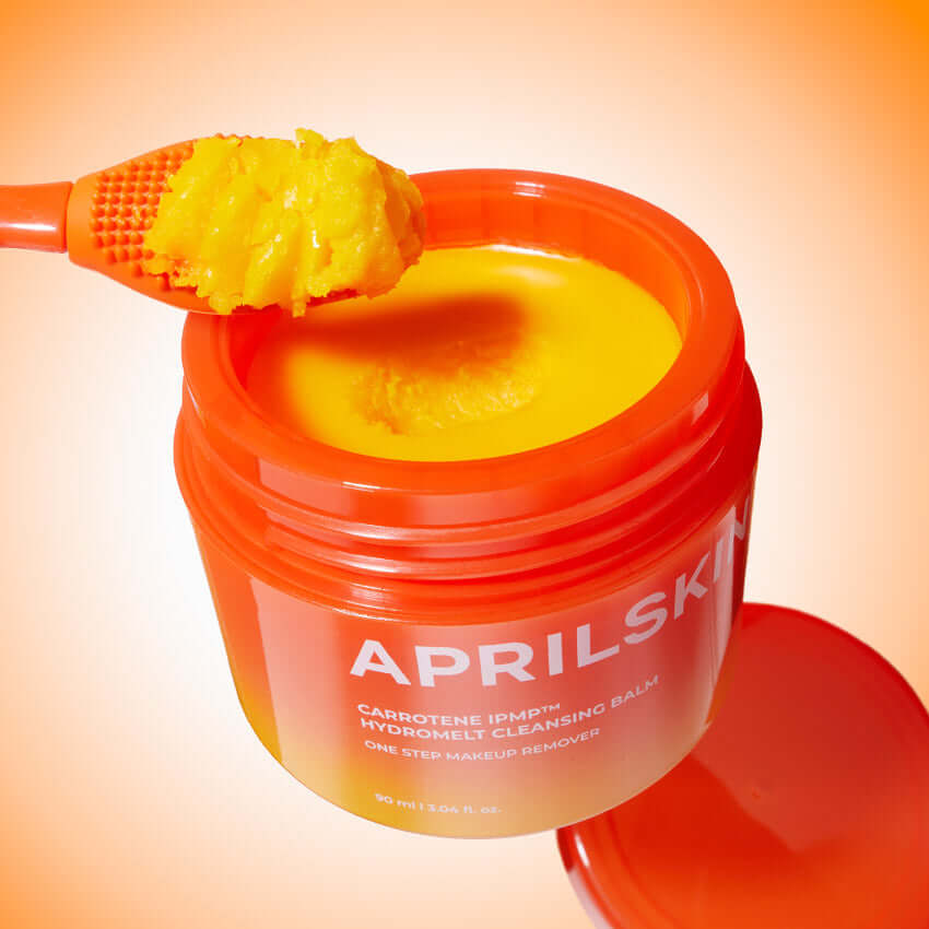 APRILSKIN Carotene Melting Cleansing Balm in open jar with spatula