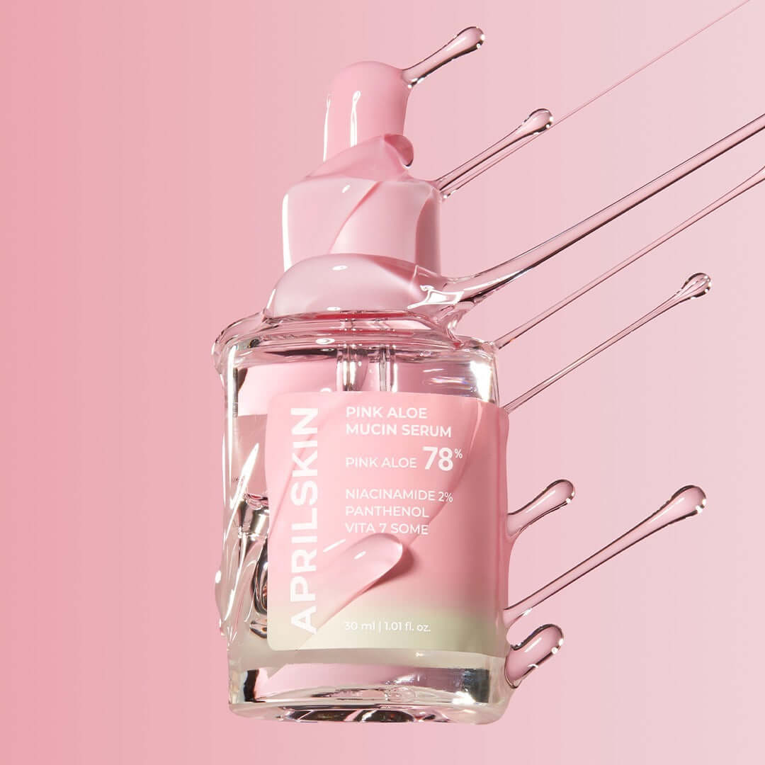 APRILSKIN Pink Aloe Mucin Serum bottle with pink liquid and aloe design, showcasing skincare benefits.
