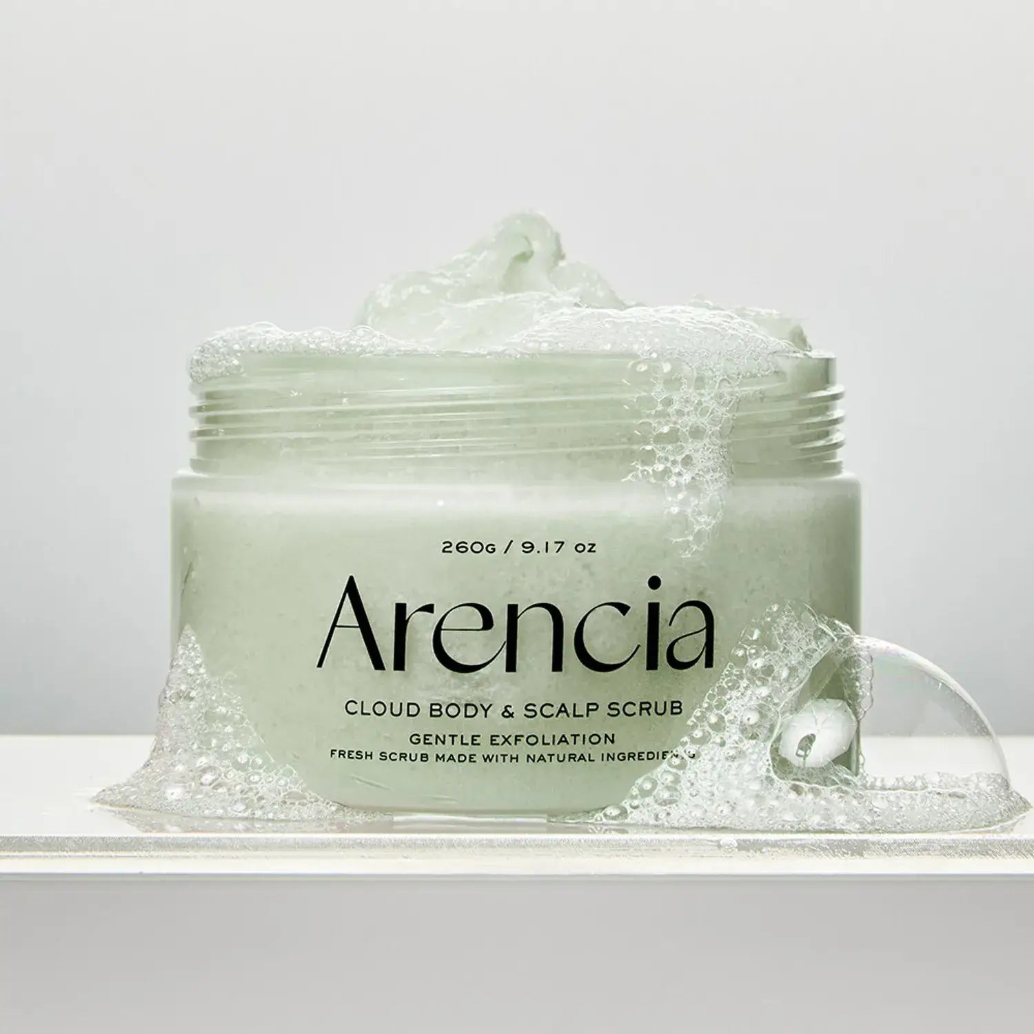 ARENCIA Fresh Cloud Body Scrub 260g jar with gentle exfoliation soap bubbles, showcasing premium skincare product for radiant skin
