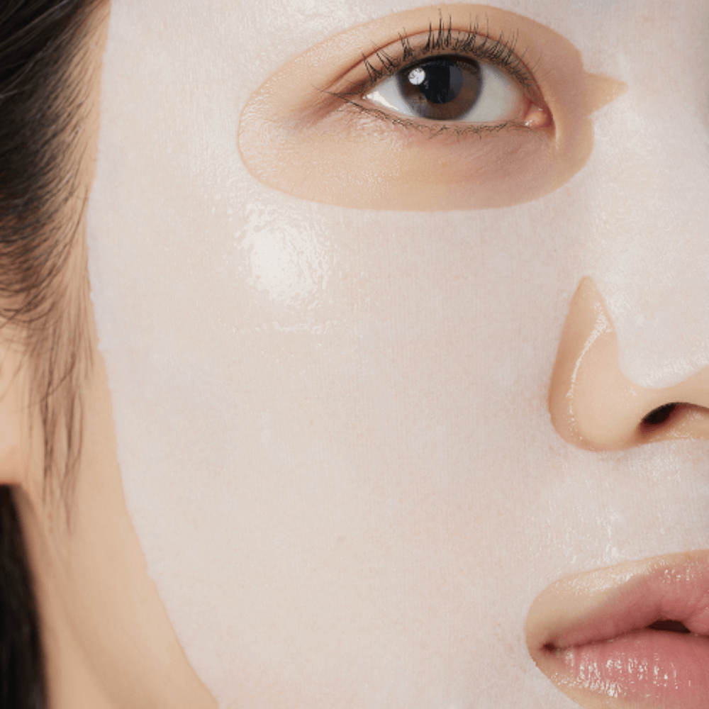 Close-up of a woman using ARENCIA Holy Hyssop Mask Pack (5 piece) for skincare