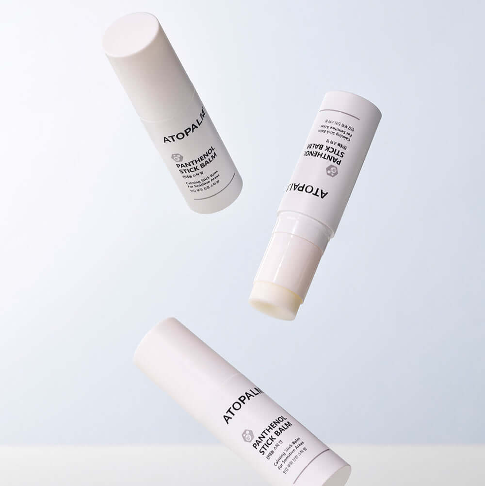 ATOPALM Panthenol Stick Balm 10g shown in three different angles on a light background