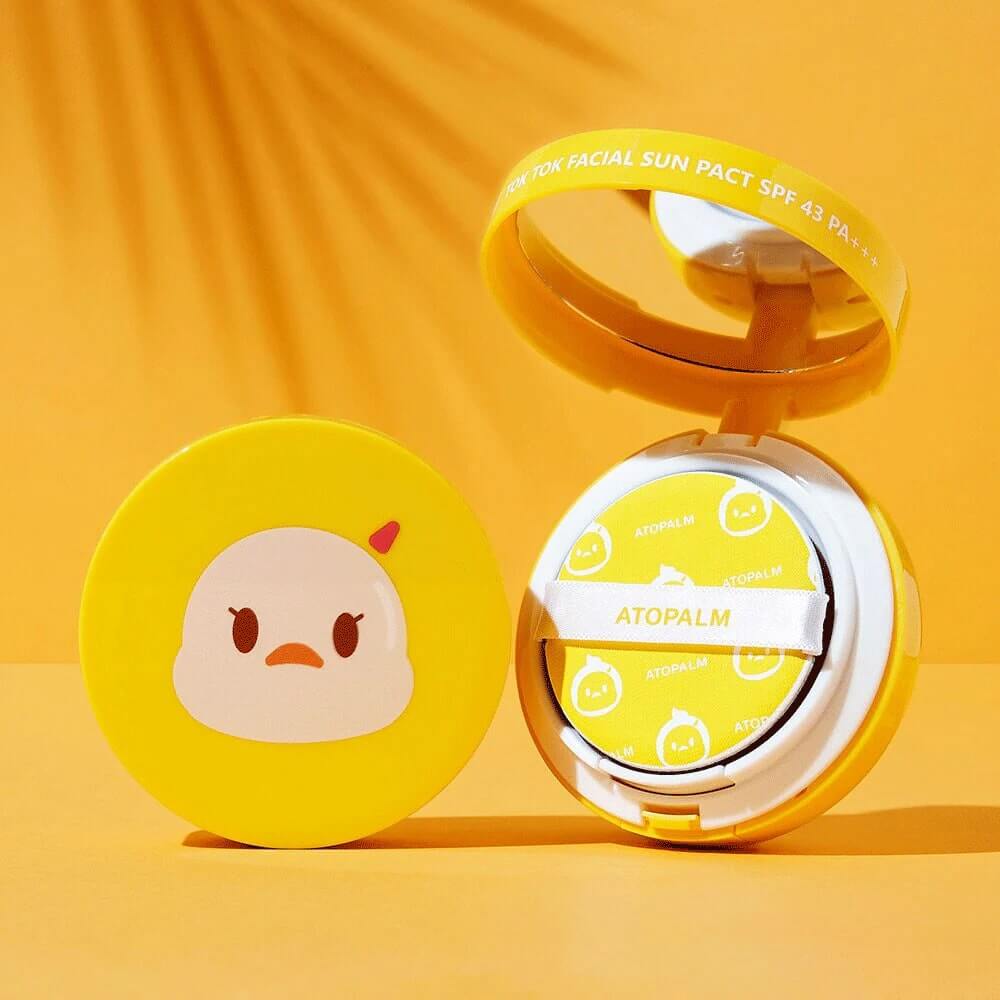 ATOPALM Toktok Facial Sun Pact SPF43 PA+++ 15g in yellow compact with mirror on orange background