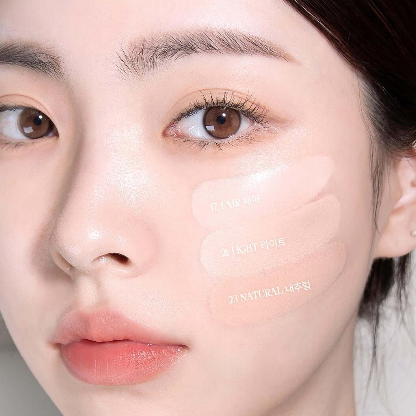 Model wearing BBIA Eau Glow Cushion with three shades on cheek for comparison
