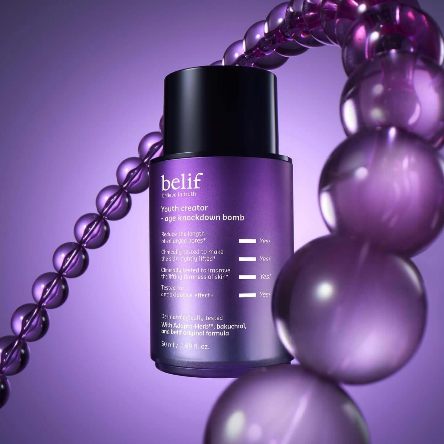 BELIF Age Knockdown Bomb Serum 50ml with purple background and beads.