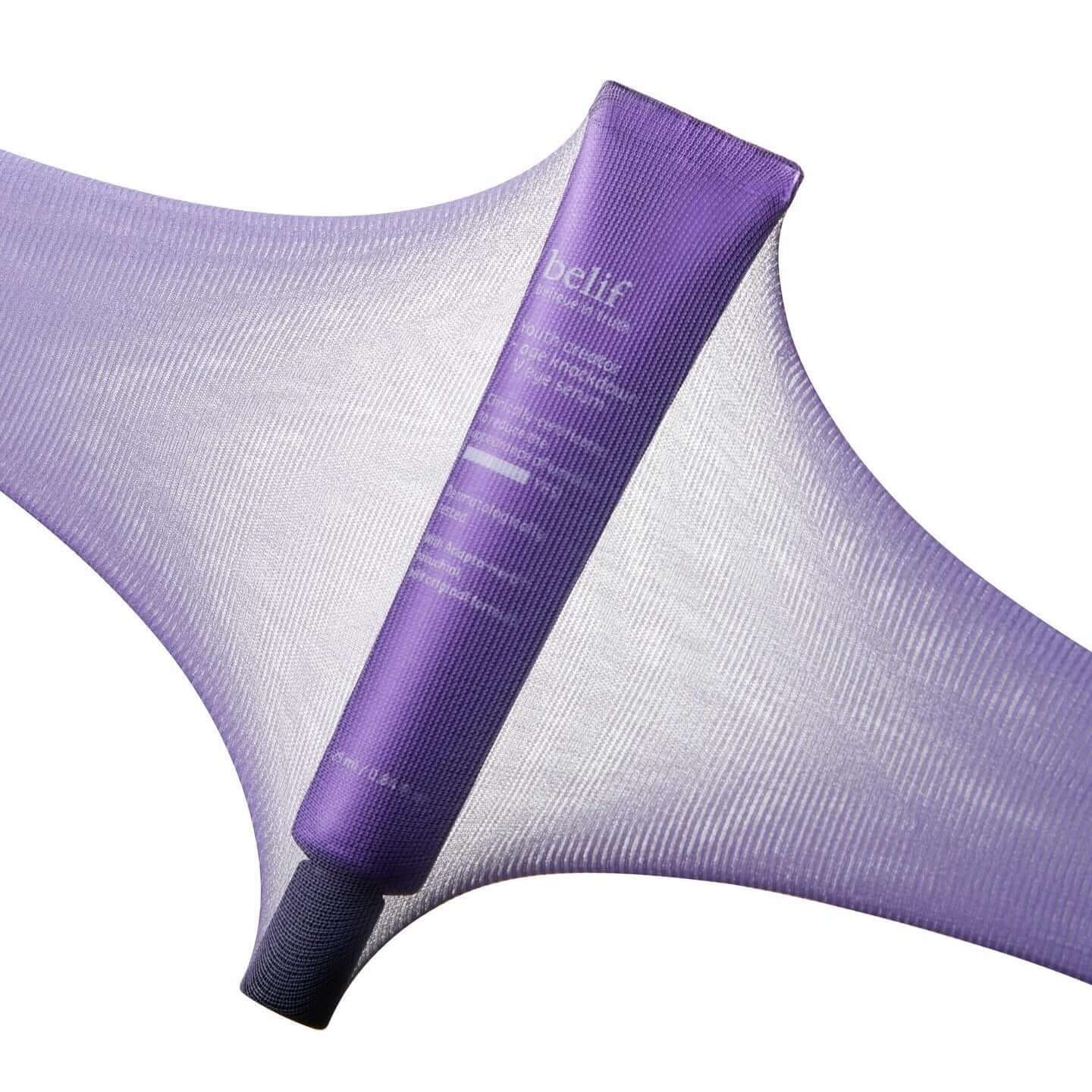 BELIF Age Knockdown V Eye Serum 25ml in purple tube on textured background