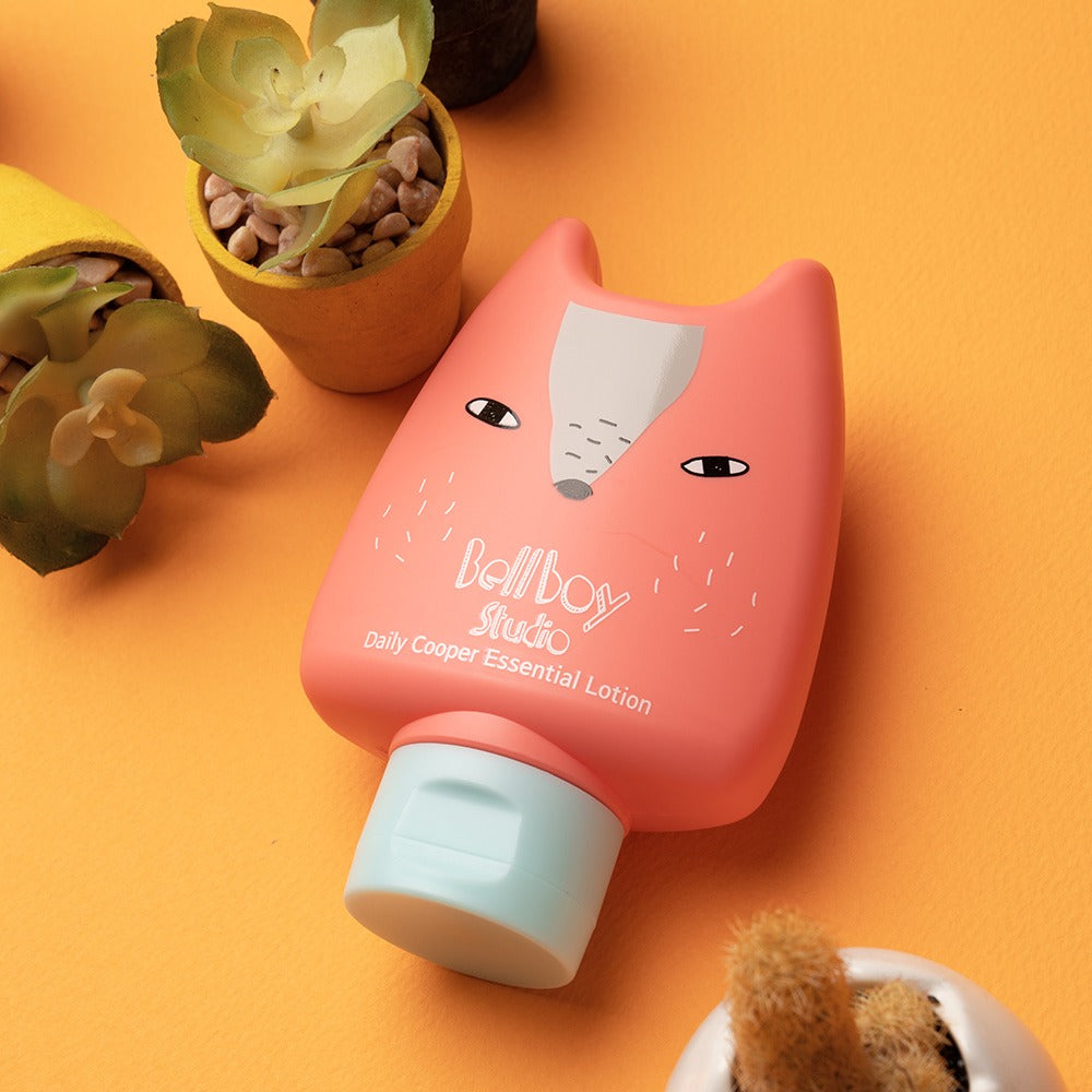 BELLBOY STUDIO Daily Cooper Moist Multi Lotion 160ml with playful packaging, displayed next to potted plants on an orange surface.