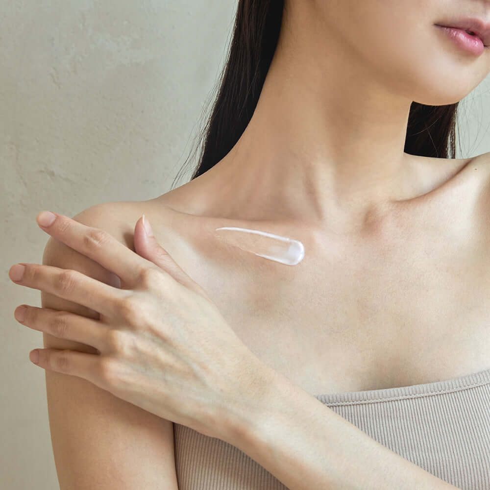 Applying BENTON Ceramide Calming Ato Body Lotion 300ml on shoulder