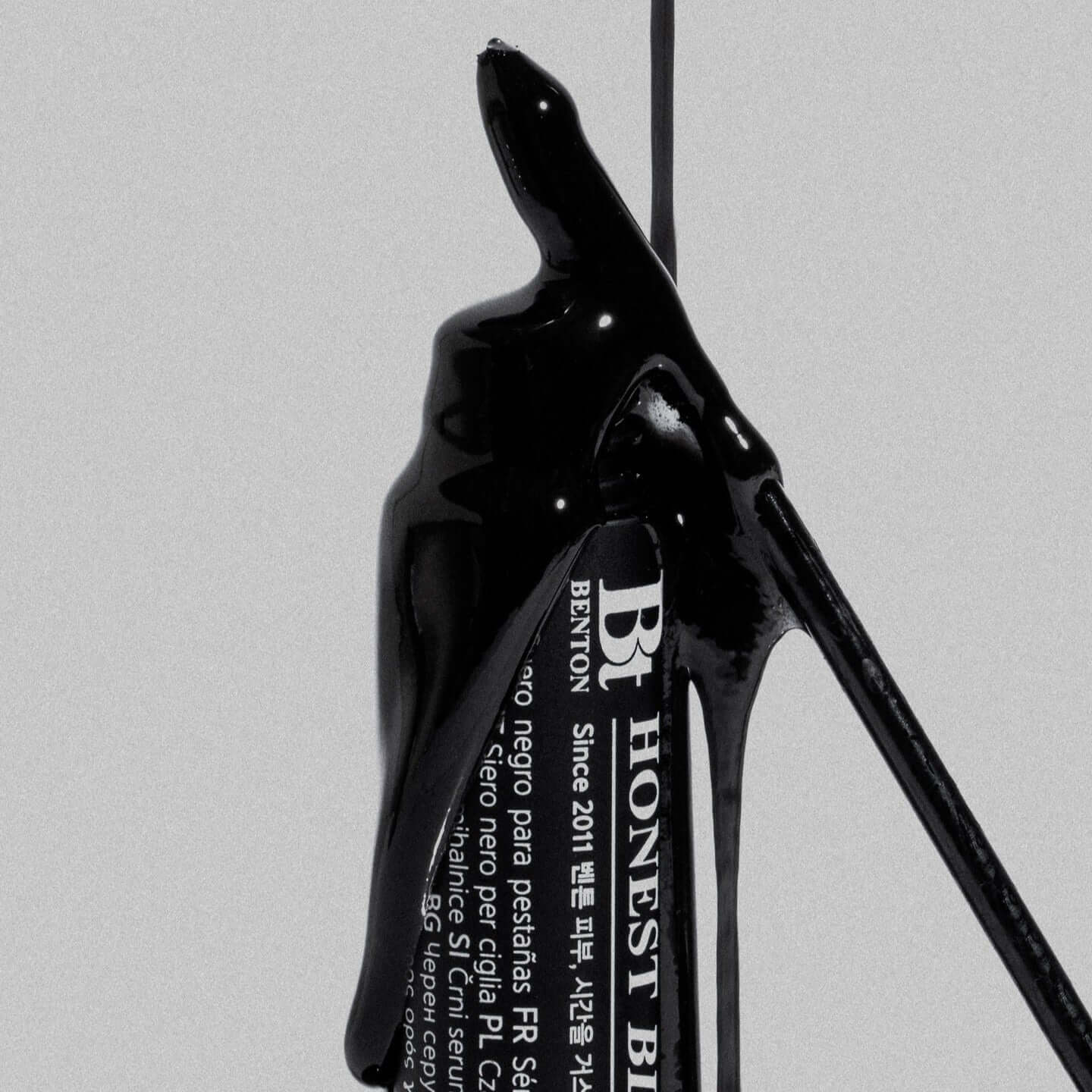 BENTON Ernest Black Eyelash Nutrient 8ml close-up with rich black texture and sleek packaging design for nourishing eyelashes.