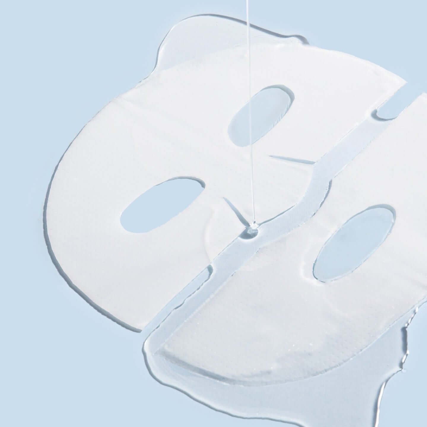 Close-up of BENTON Hydrogel Collagen Mask Pack 27g x4 showing transparent mask texture on a light blue background.