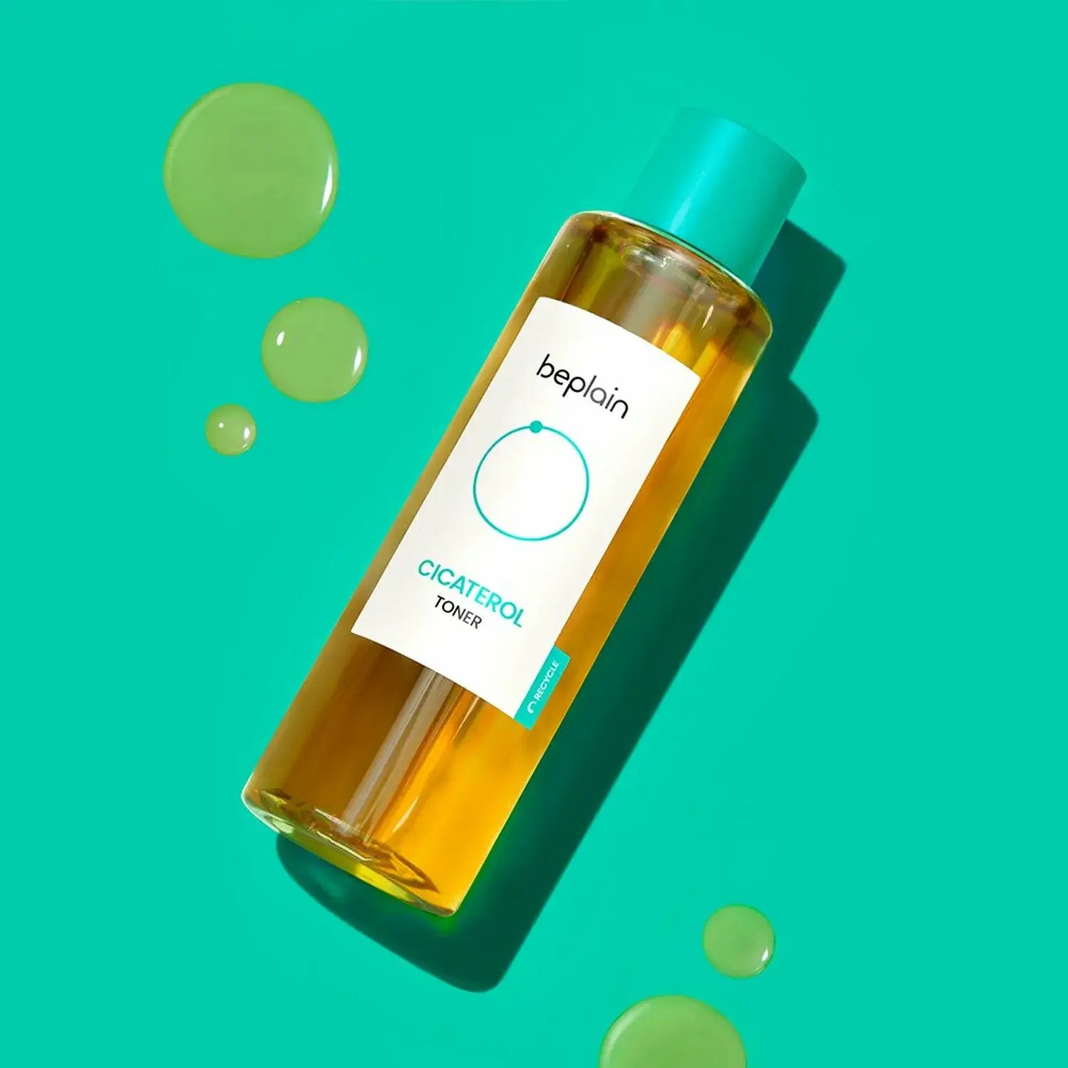 BEPLAIN Cicaterol Toner bottle on a turquoise background with liquid droplets