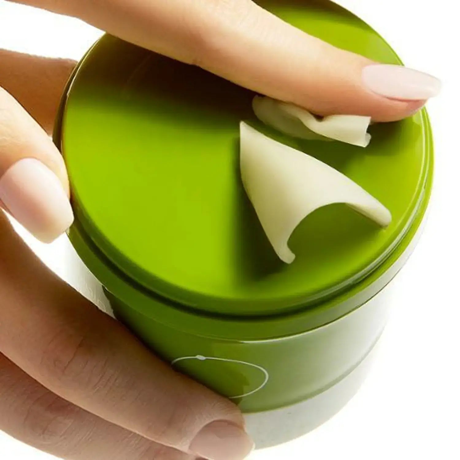Hand applying BEPLAIN Green Bean Pore Grinding Cleansing Balm from a green container, showcasing its smooth texture.