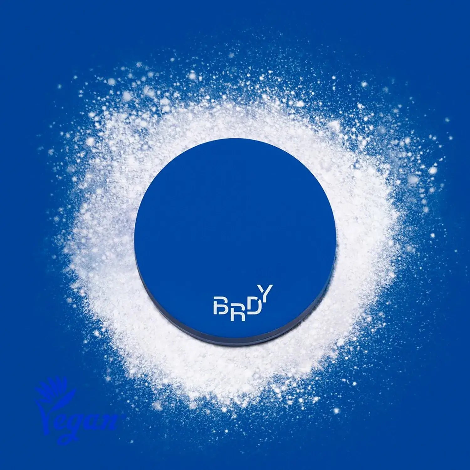 B.READY Blue Sebum Powder in a stylish blue container surrounded by white powder, highlighting its vegan and sebum control features.