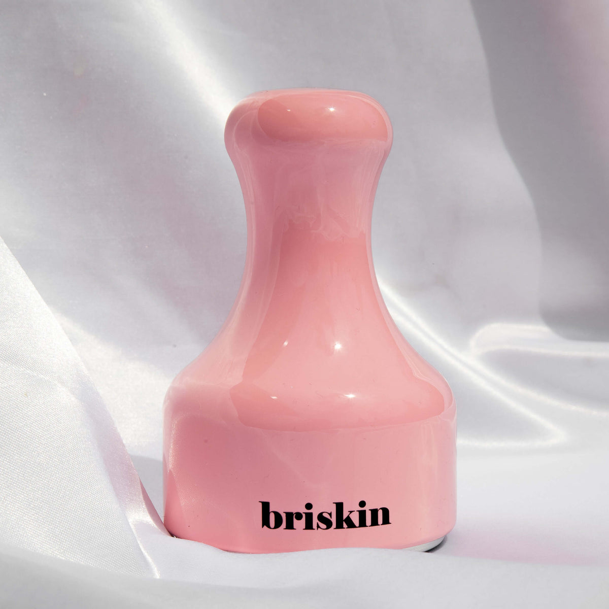 BRISKIN Face & Body Calming Ice Therapy pink tool on fabric
