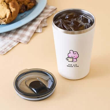BT21 Basic Tumblr Cup 473ml next to lid on table with cookies in background