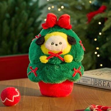 BT21 Minini Petit Holiday Tree Plushy on a festive table setting with holiday decorations in the background