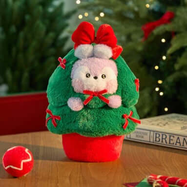 BT21 Minini Petit Holiday Tree Plushy with festive red and green design on a wooden table, creating a cozy holiday ambiance.