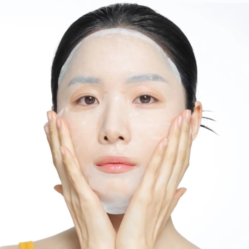 Person using CELIMAX Brightening Pore Blemish Serum Mask 10 sheets