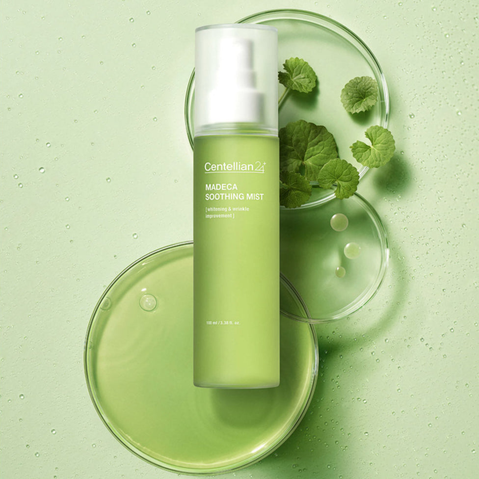 CENTELLIAN 24 Madeca Bottle Grass Mist 100ml on green background with leaves and droplets