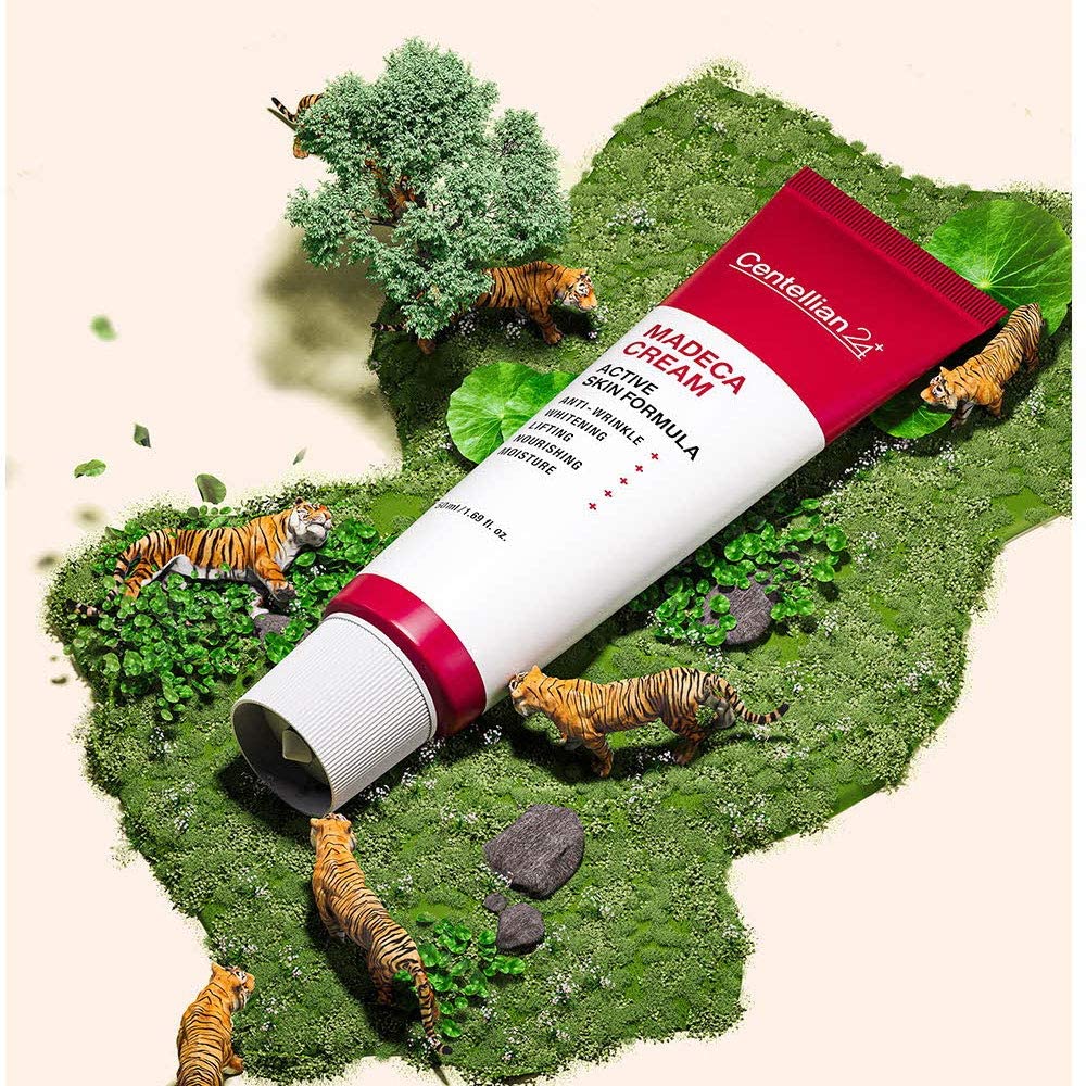 CENTELLIAN 24 Madeca Cream Active Skin Formula 50ml tube on decorative display with tigers and greenery