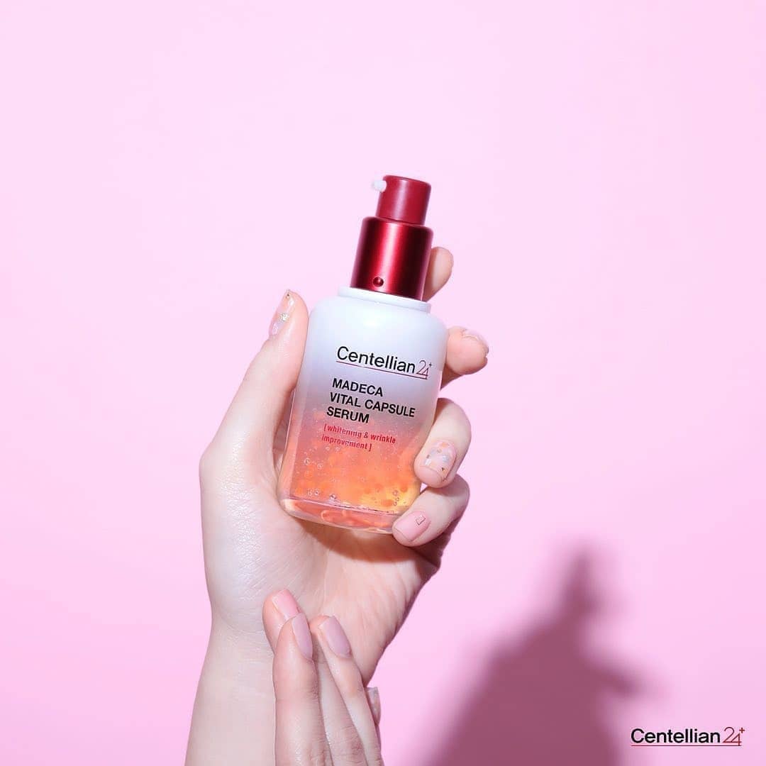 CENTELLIAN 24 Madeca Vital Capsule Serum 50ml held in hand against pink background