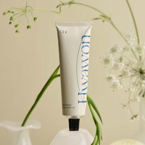 CHWI (CHI) Handcream 50ml on display with floral background