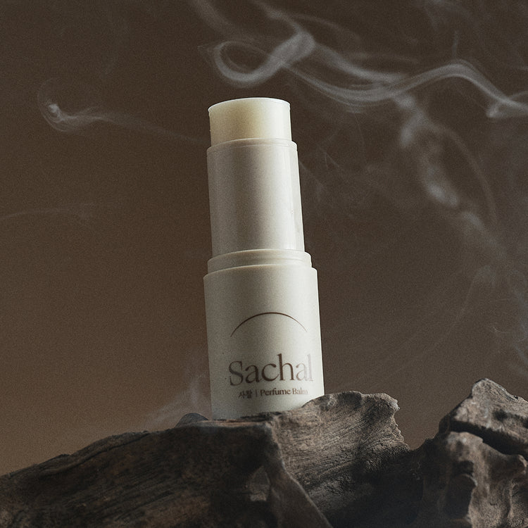 CHWI (CHI) Parfume Balm 4.6g displayed with elegant design and natural setting