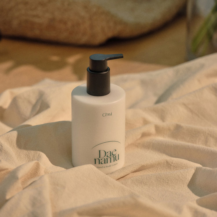 CHWI (CHI) Dae Namu Hand & Body Lotion 300ml bottle on fabric background