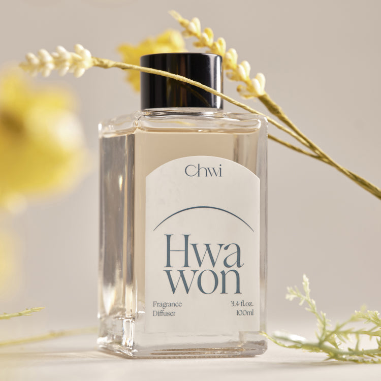 CHWI (CHI) Hwa Won Diffuser 100ml bottle surrounded by soft yellow flowers.