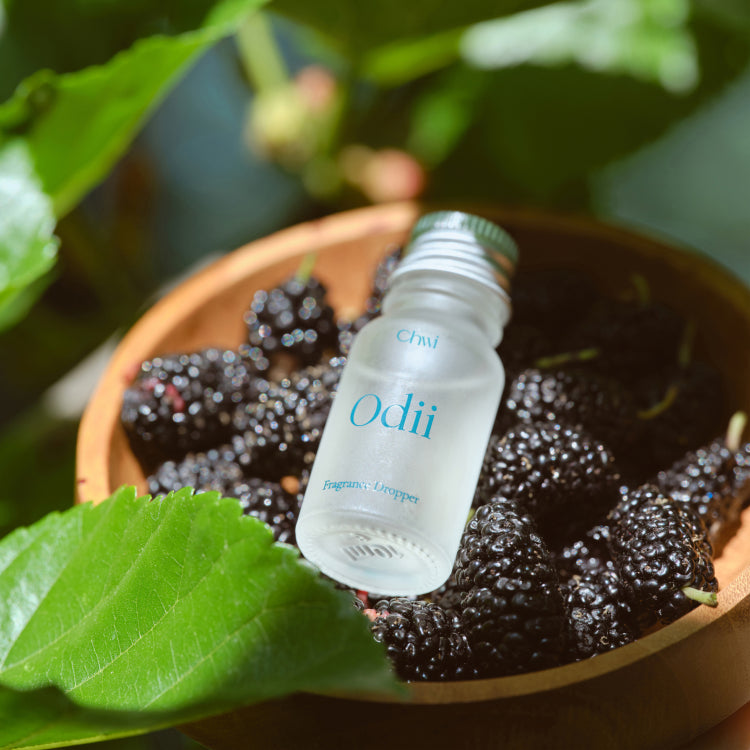 CHWI (CHI) Odii Frangrance Dropper 10ml placed on blackberries with green leaves in background