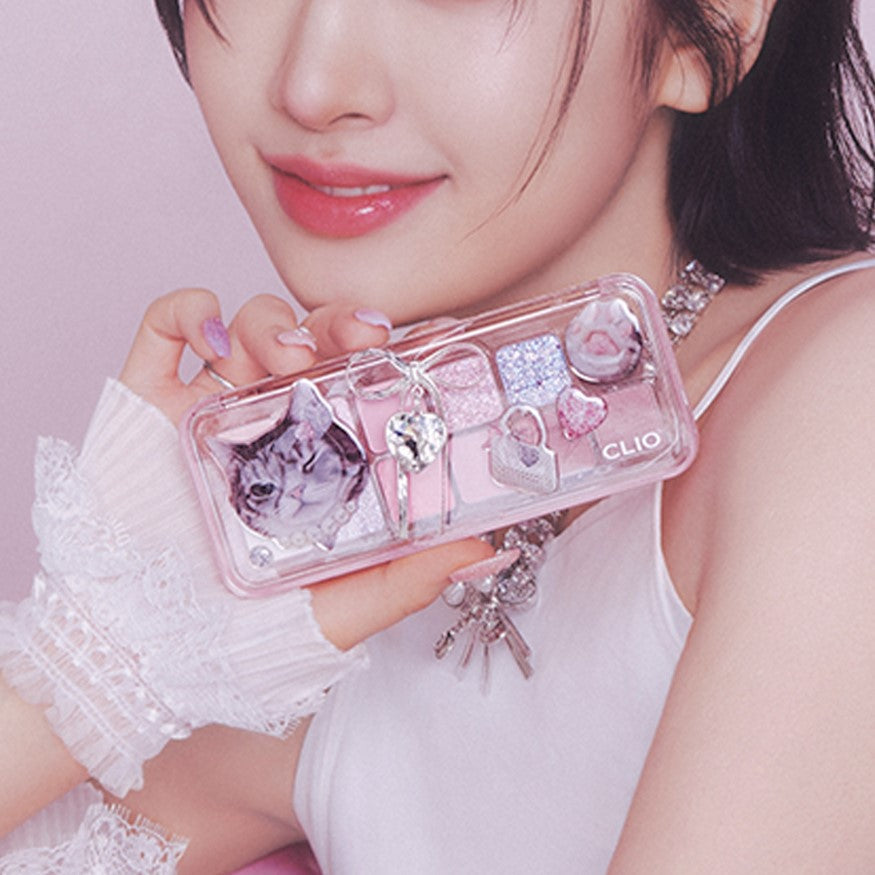 CLIO Pro Eye Palette Air (#01 to #15) featuring assorted shades in a decorative case held by a person with pink nails and stylish outfit.