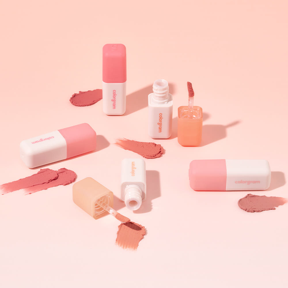 Assorted COLORGRAM Nude Blur Tint products arranged with swatches on a peach background.
