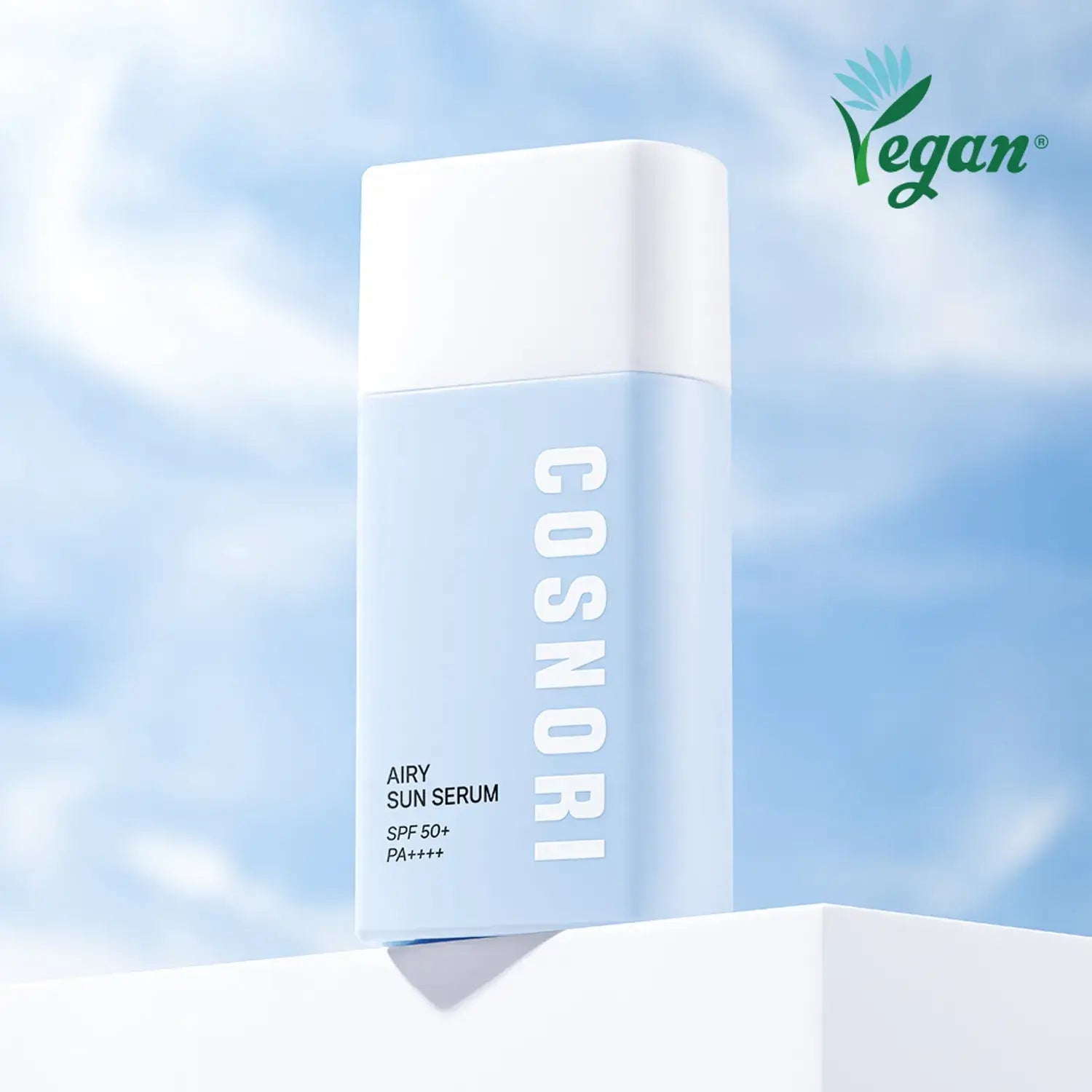COSNORI Airy Tone Up Sun Serum with SPF 50+ PA++++, vegan-friendly skincare against a blue sky background.