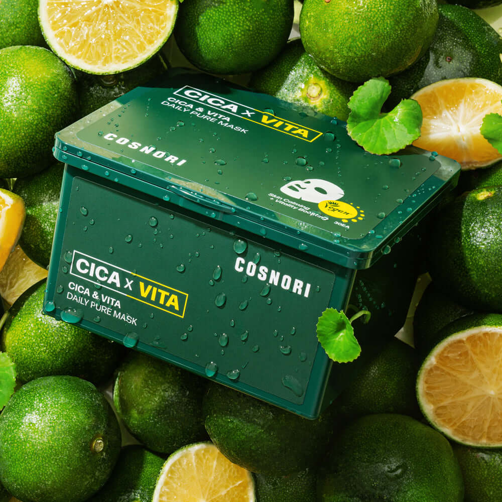 COSNORI Cica & Vita Daily Pure Mask 35ml surrounded by fresh lime slices, showcasing the vibrant green packaging.