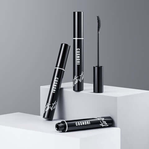 COSNORI Eyelash Tinting Serum Deep Black tubes displayed on pedestal