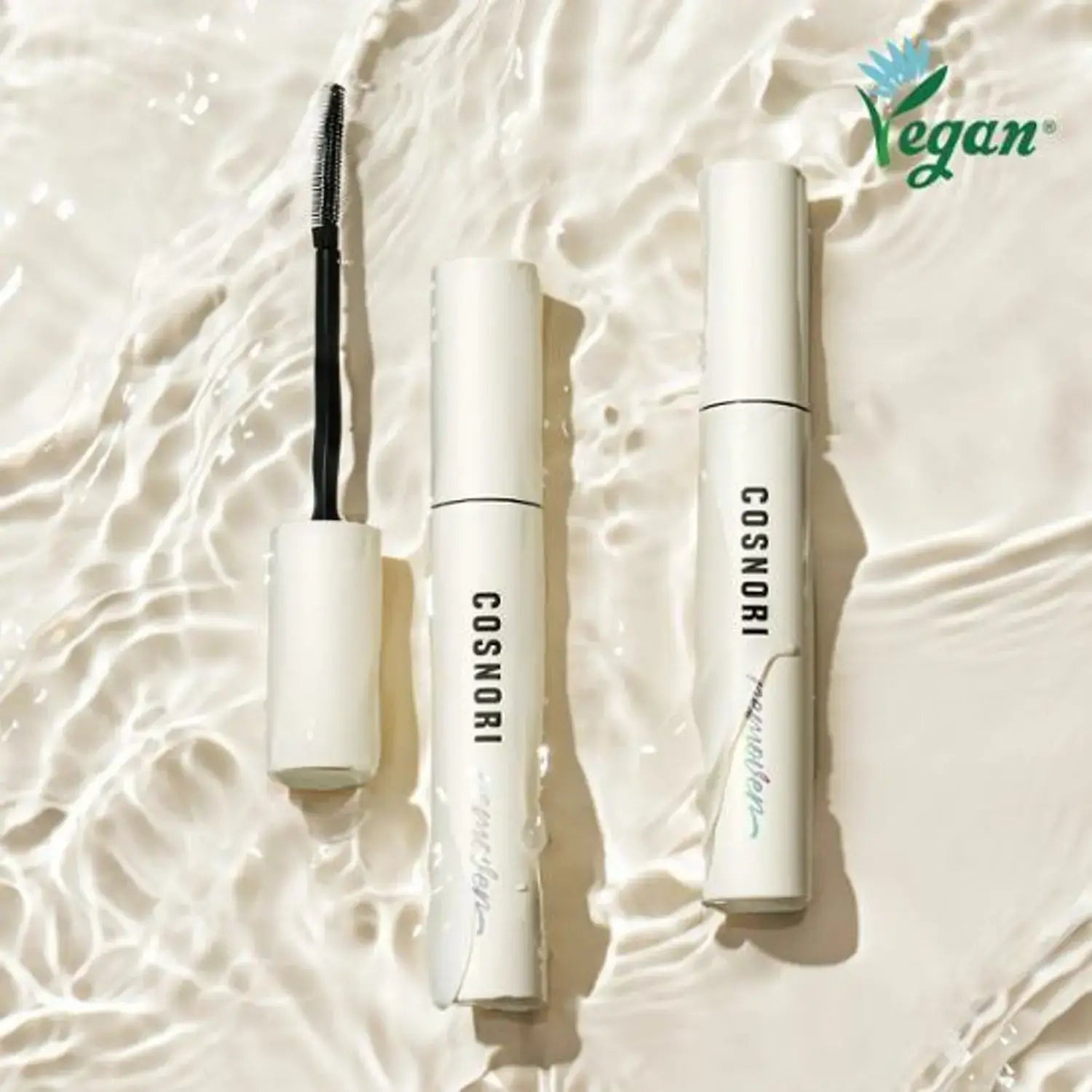 Image of COSNORI Long Active Mascara Remover with vegan logo in minimalist packaging on textured background.