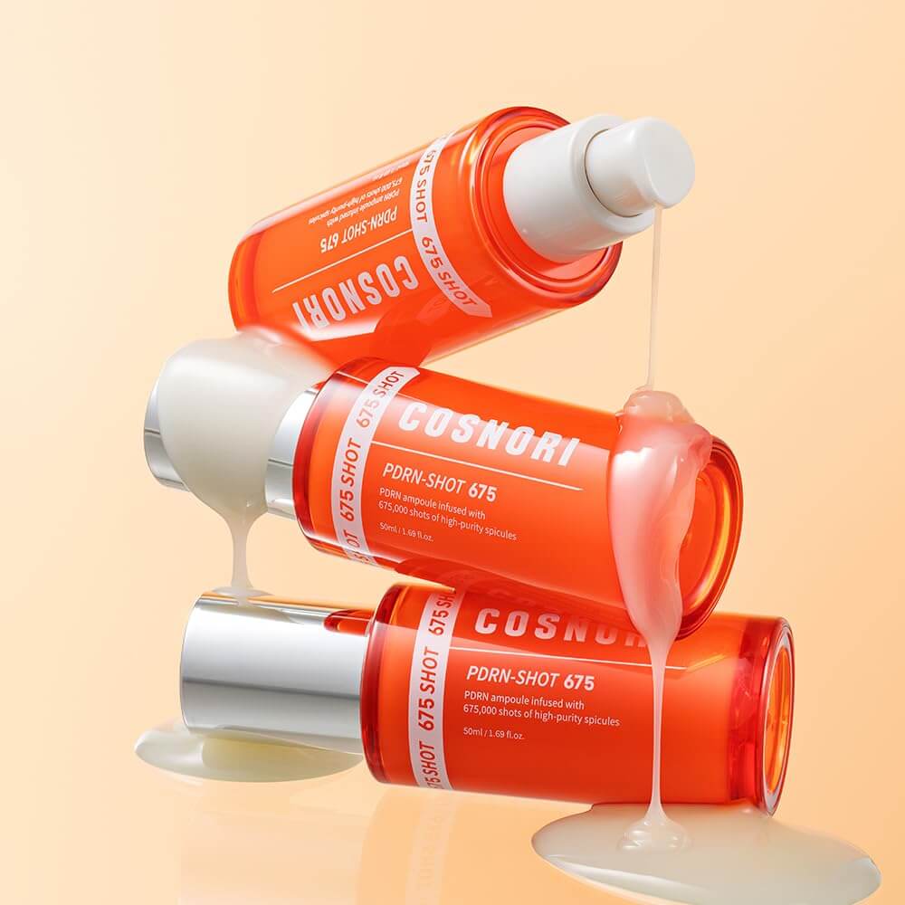 COSNORI PDRN Shot 675 50ml bottles with skincare serum pouring out, showcasing the product's texture and packaging.