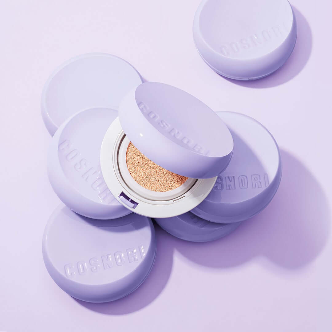 COSNORI Panthenol Barrier Cushion SPF50+PA++++ compact on purple background
