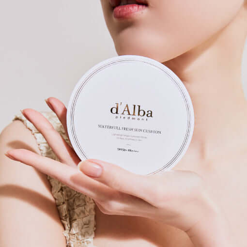 D'ALBA Waterfull Fresh Sun Cushion held by model, highlighting packaging and design.