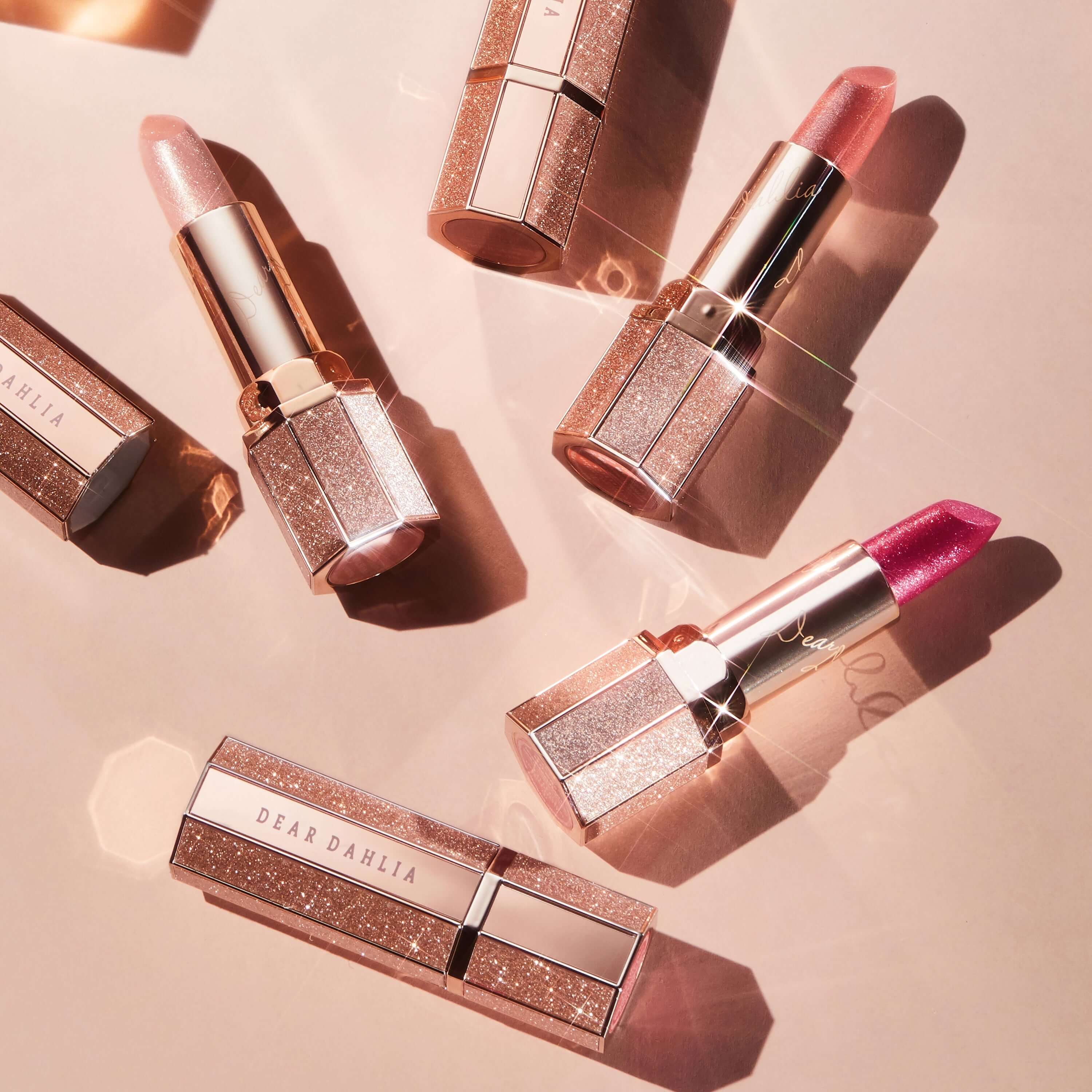 DEAR DAHLIA Allure Shine Lustrous Lip Plumper collection on pink background